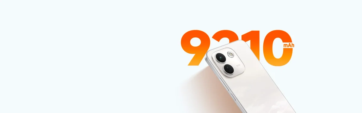 Xiaomi Redmi Turbo 6 Max: Traseira de celular branco com duas câmeras ao lado do número 9210 mAh em laranja, sobre fundo azul claro; parte do aparelho cortada.
