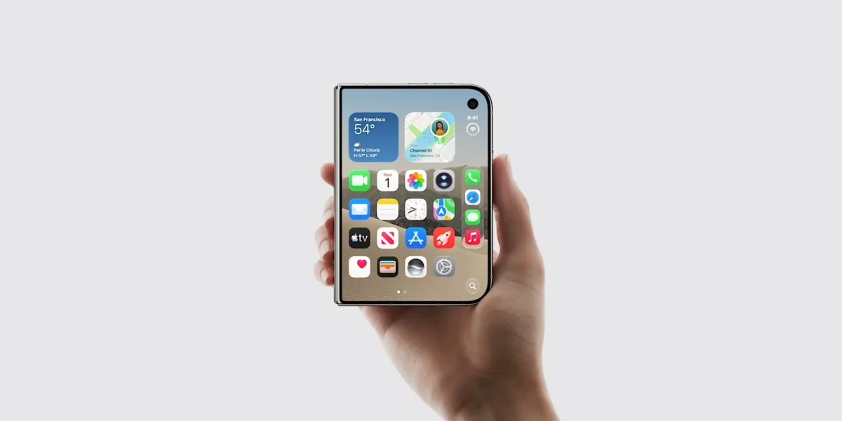 Apple iPhone Duo: Render de celular dobrável em formato de livro, de frente, com tela de início, segurado por uma mão em fundo cinza claro.