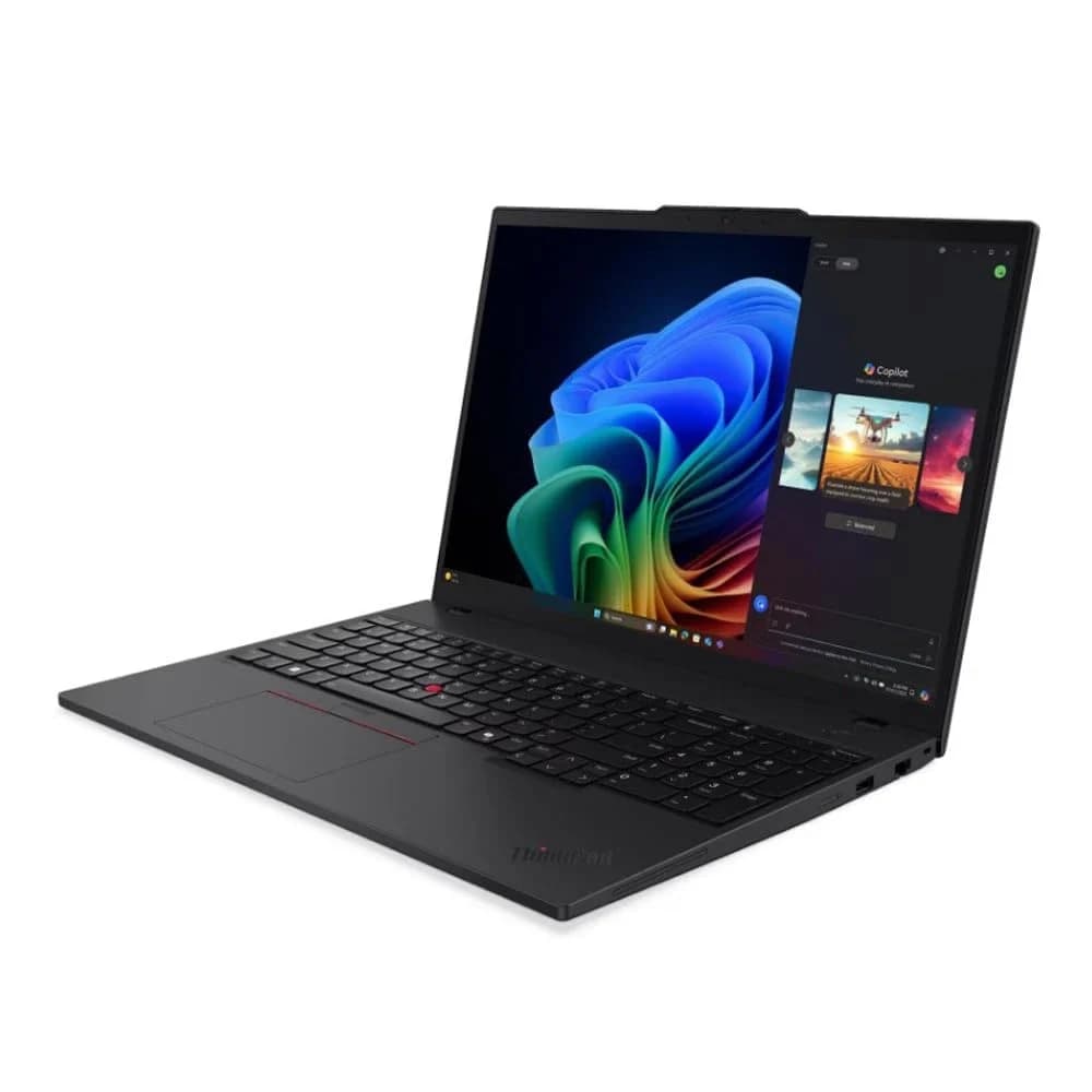 Lenovo computadores ou componentes de PC atuais: Notebook preto em ângulo de três quartos, com tela aberta exibindo papel de parede colorido e o teclado com Tra