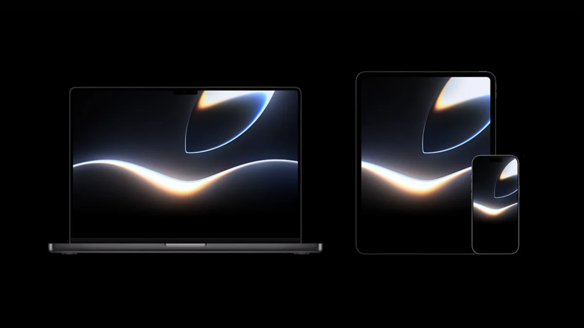 Apple macOS Golden Gate 27.2 beta, sistema operacional da Apple: Notebook, tablet e celular em fundo preto, com a mesma imagem abstrata escura e dourada nas tel